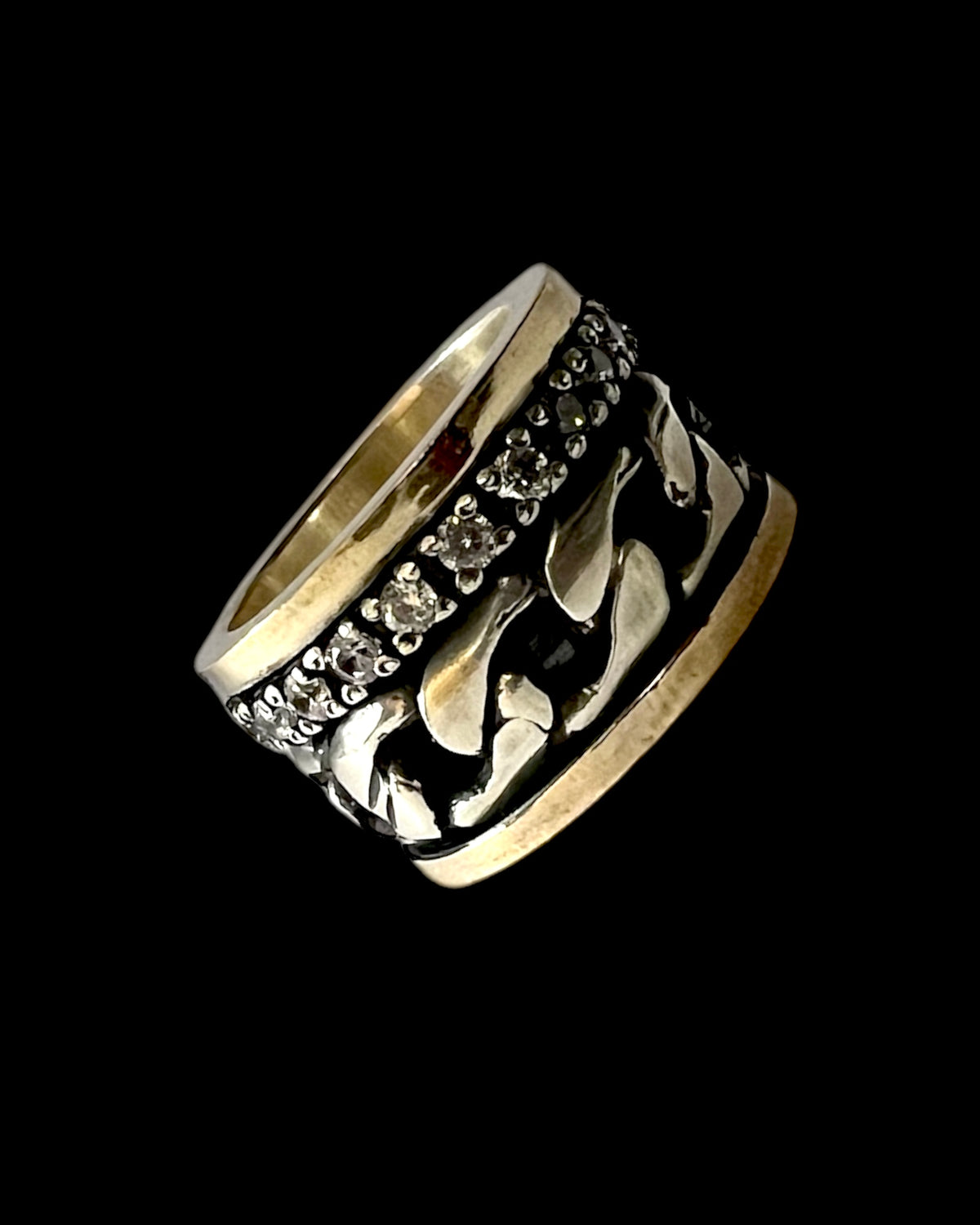 Anti-stress ring with silver and gold chain.