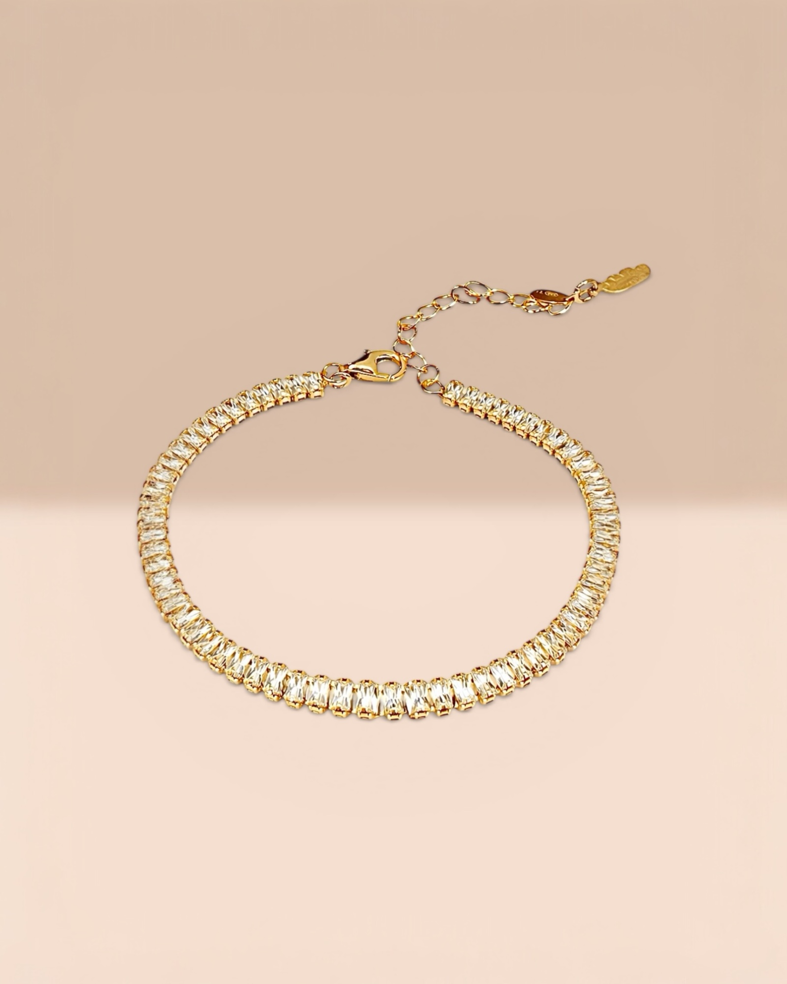 Gold-plated silver bracelet with sparkling baguette stones.