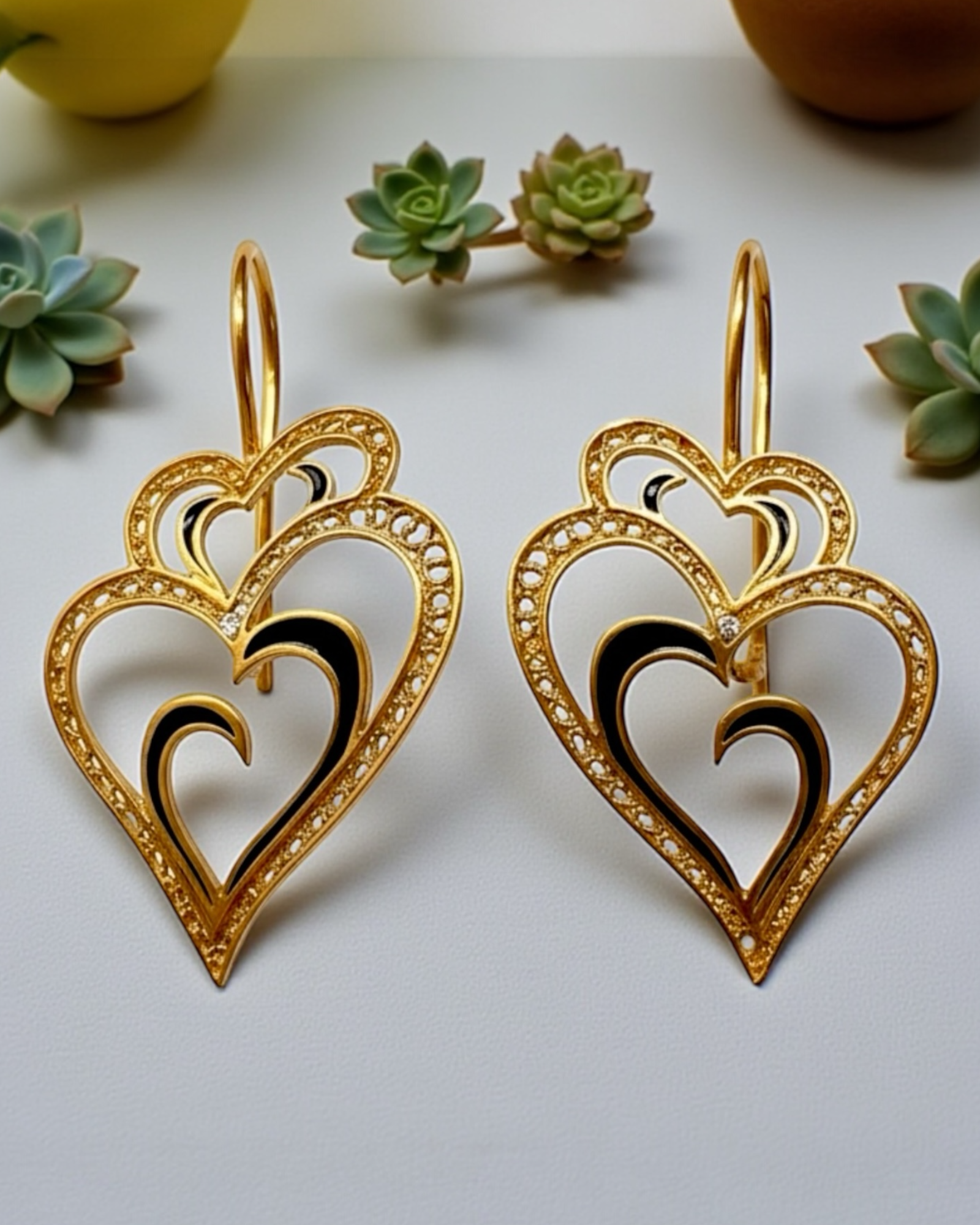 Viana is Love Heart Earrings with Black Enamel on Gold Plated Silver