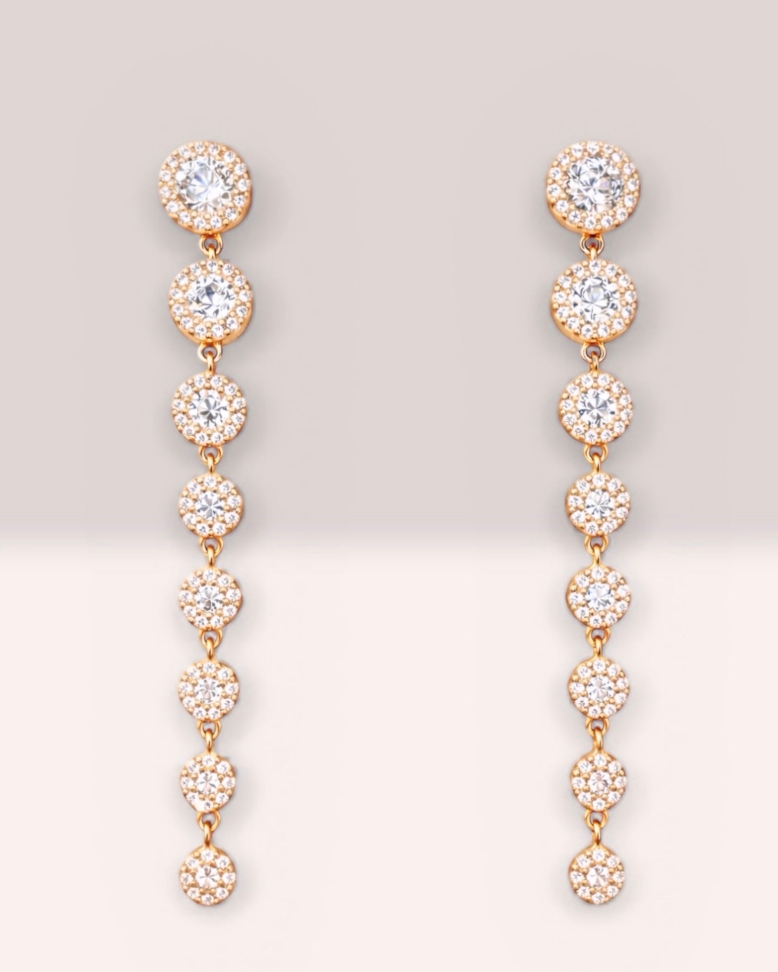 Rose gold earrings with gradient glitter.