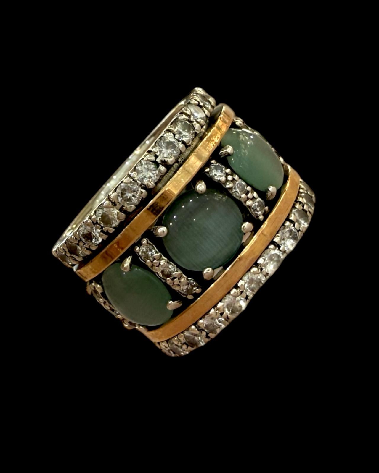 Anel Anti-Stress com Pedra Verde em Prata 925% e Ouro 9kt, com brilhantes e aro giratório.