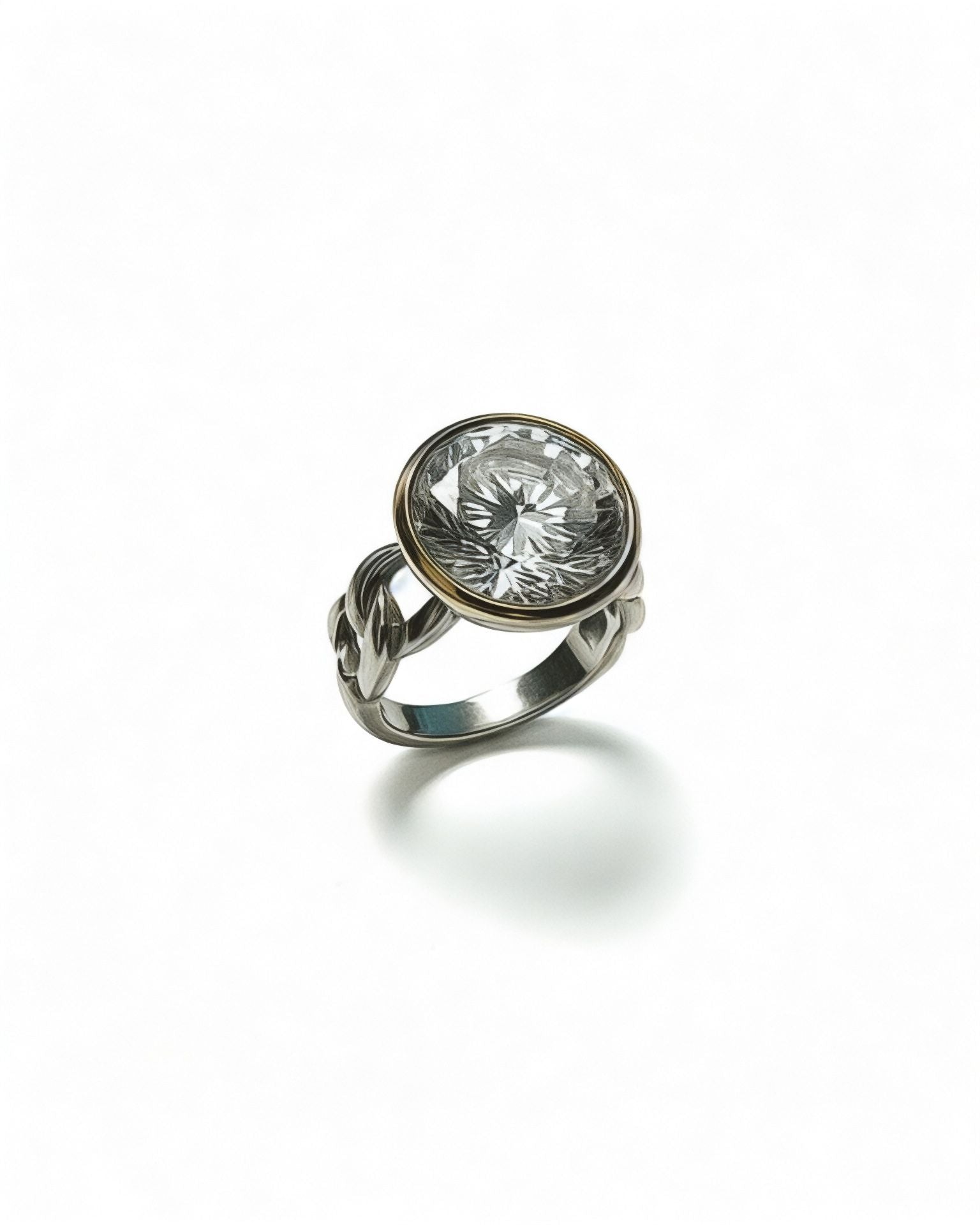Silver and gold ring with a round center stone.