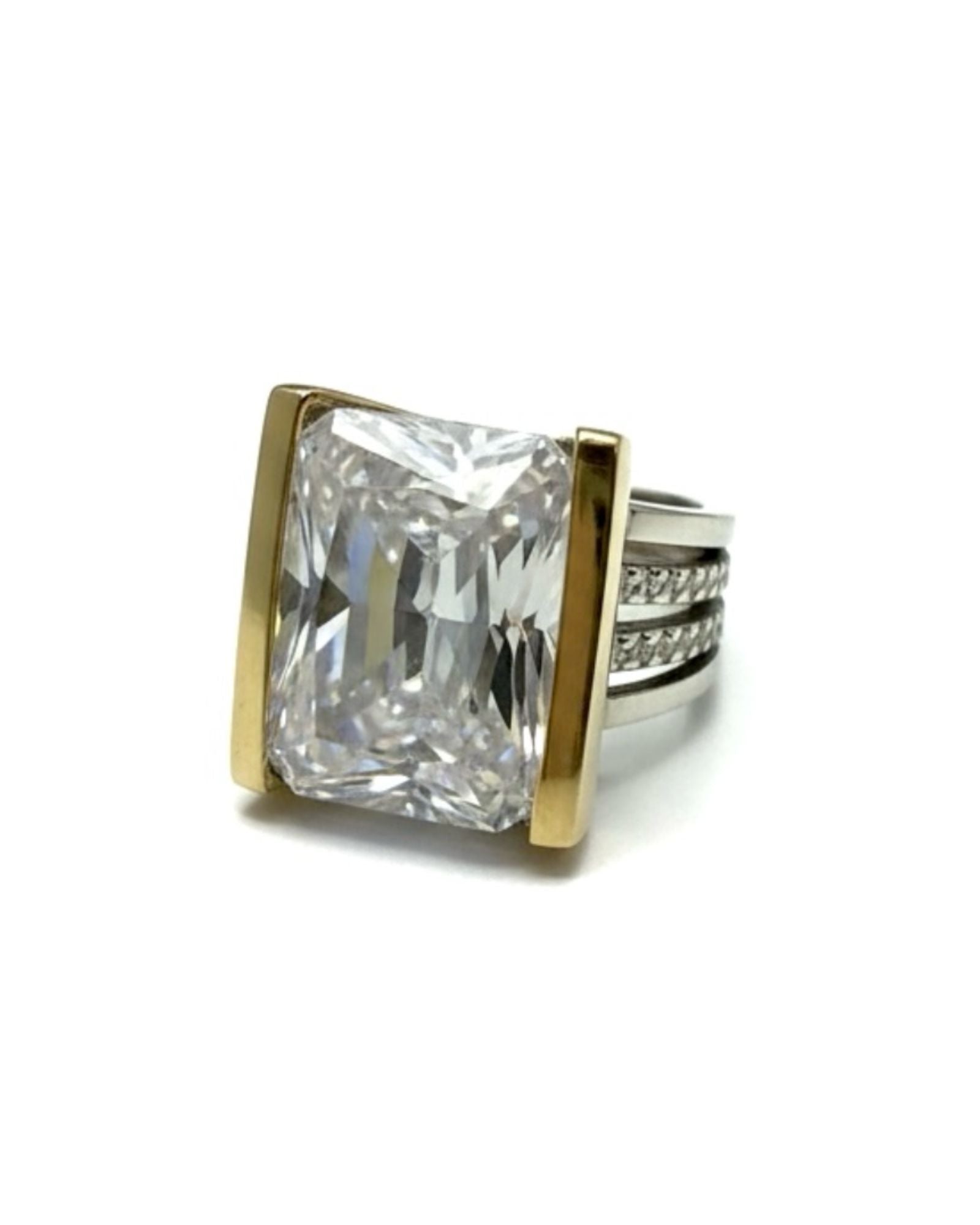 Silver and gold ring with a central stone.