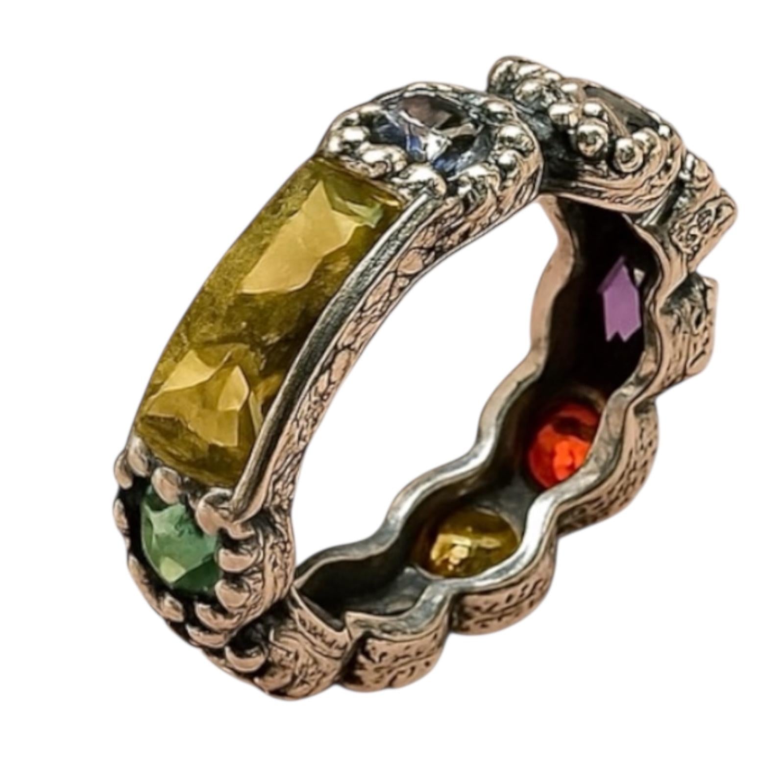 Silver and gold ring with colored stones.