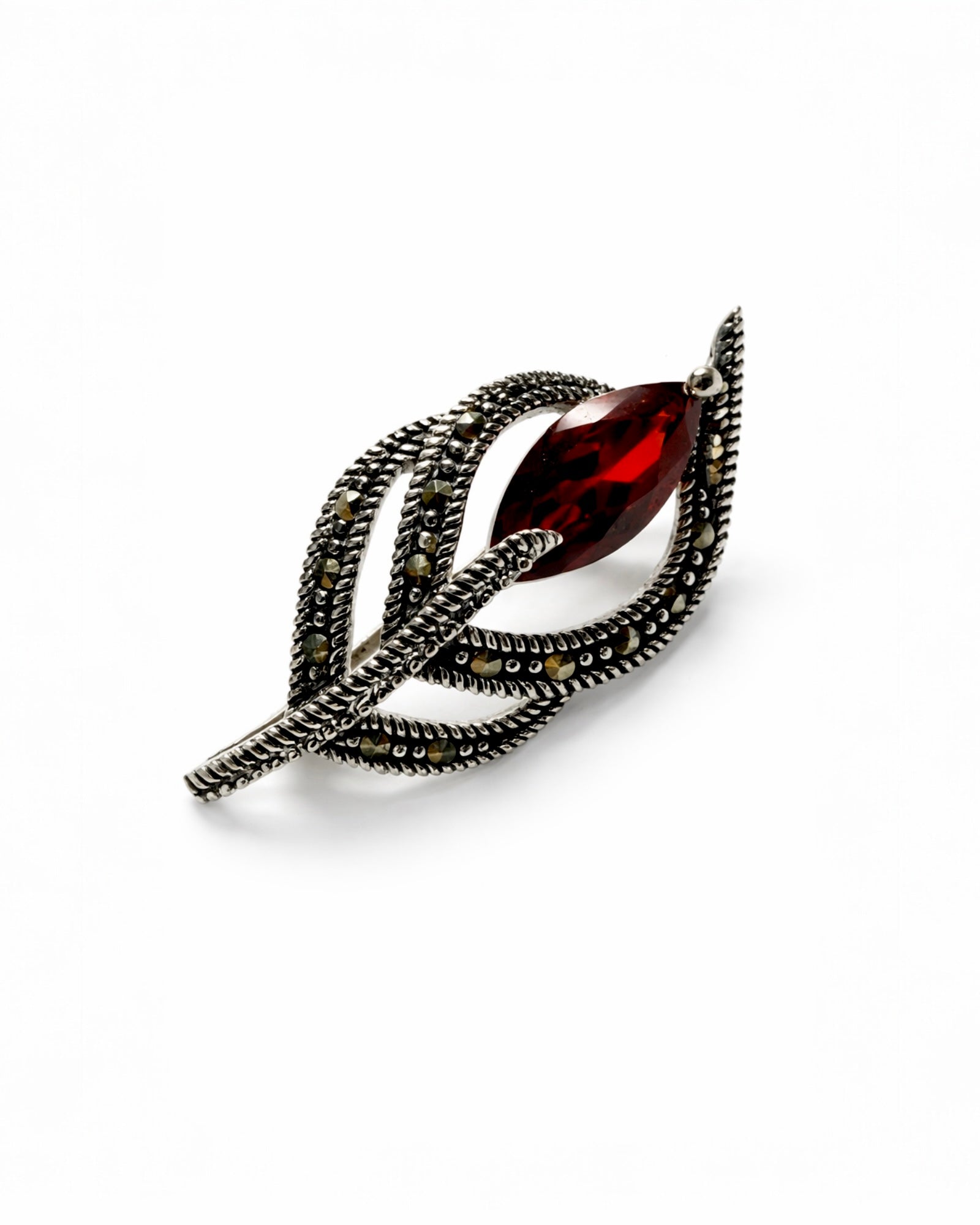 Silver-tone bow pin with marcasite and purple stone.