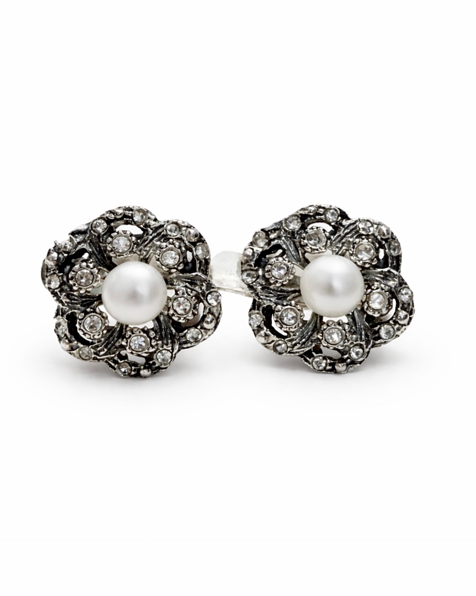 White silver earrings with cubic zirconia and omega spring charm.