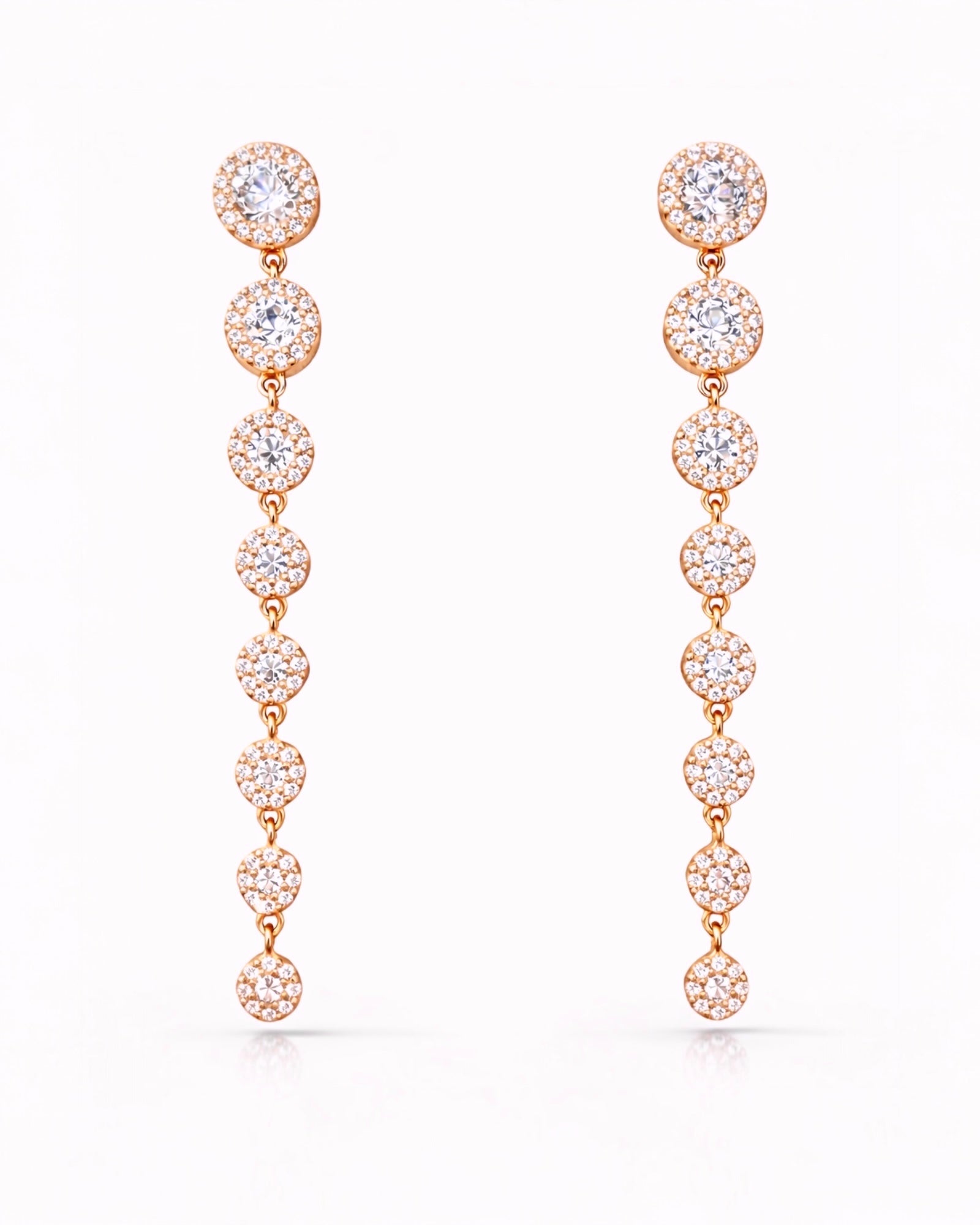 Rose gold earrings with gradient glitter.