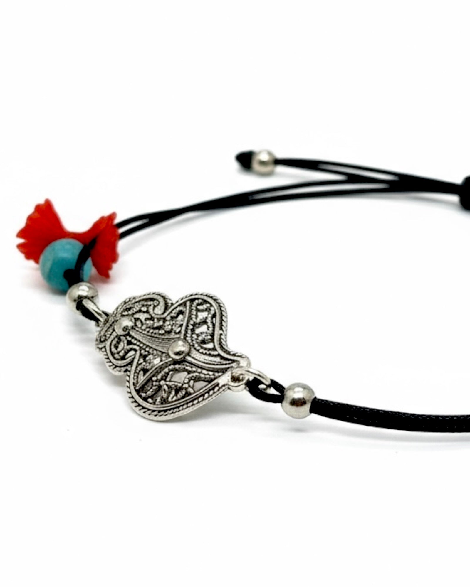 Black silk bracelet with a silver Viana heart charm.