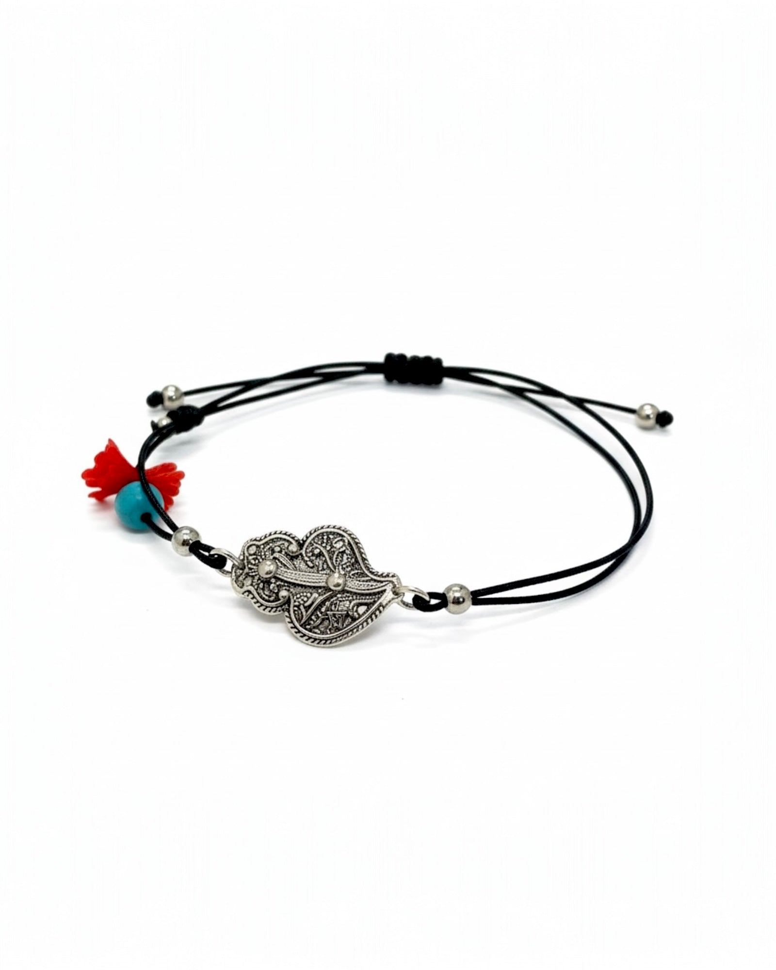 Black silk bracelet with a silver Viana heart charm.