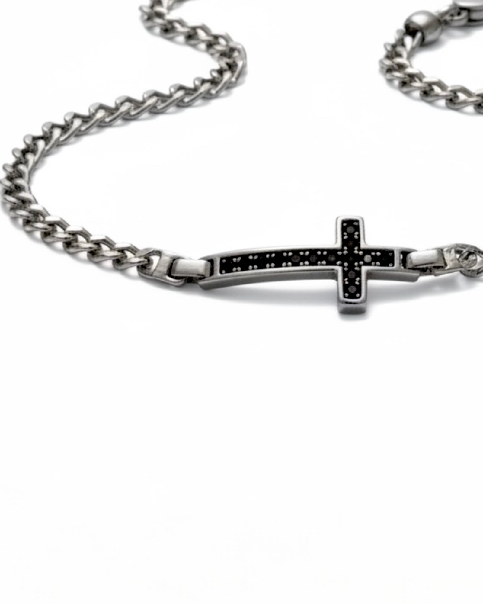 Cross bracelet with black stones in silver.
