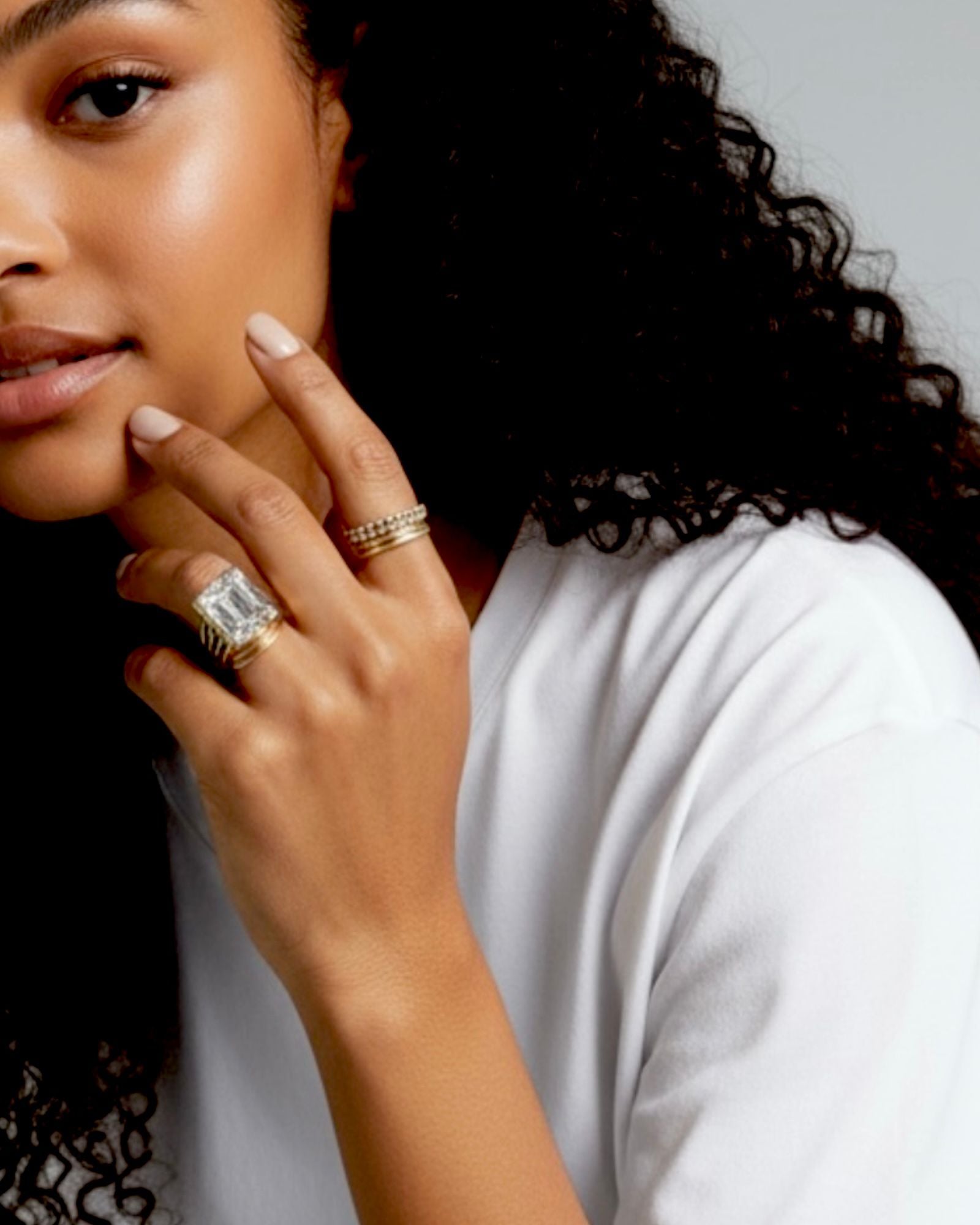 Silver and gold ring with a central stone.