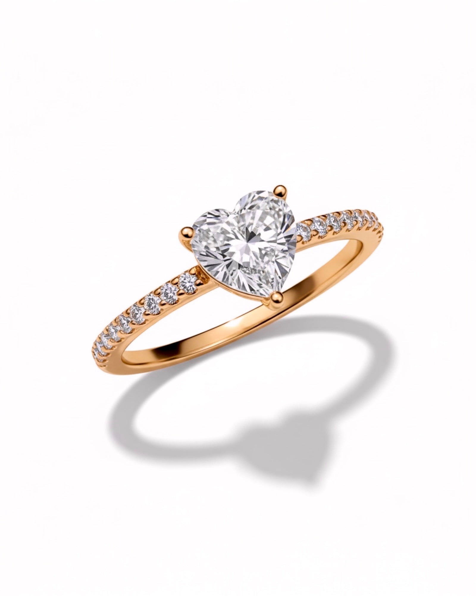 Rose gold silver ring with heart-shaped stone.