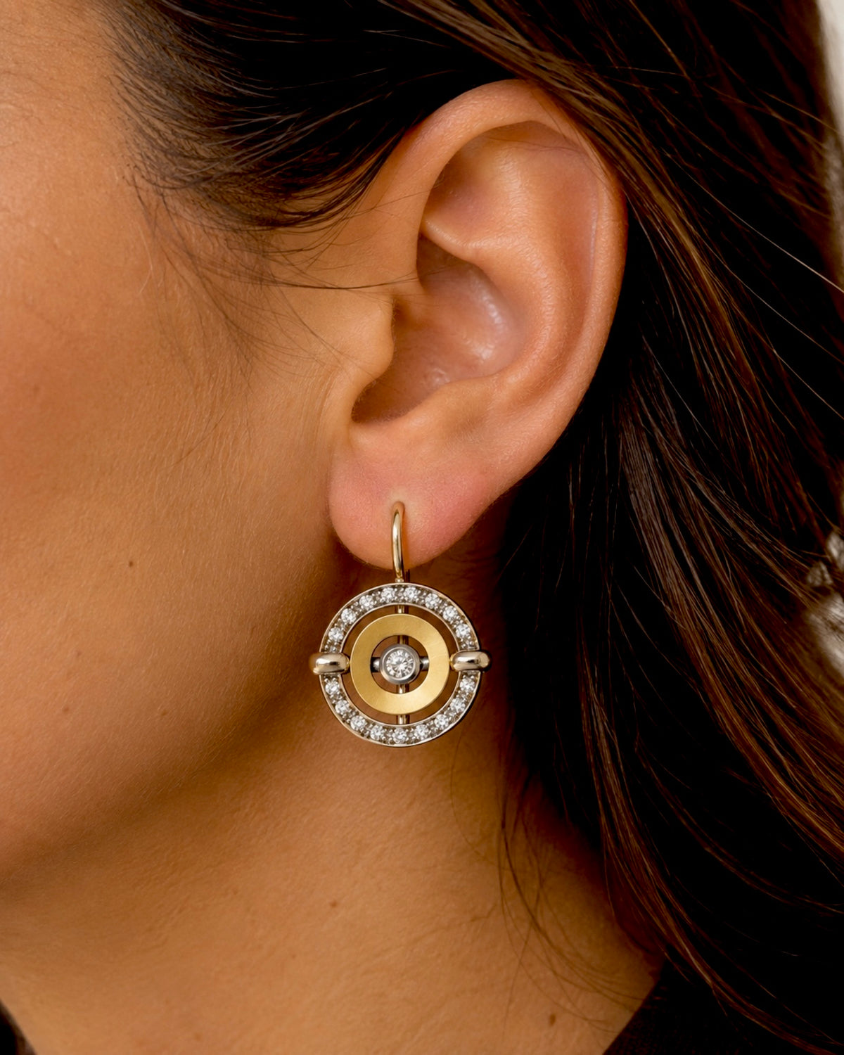 Snake earrings in silver and gold.