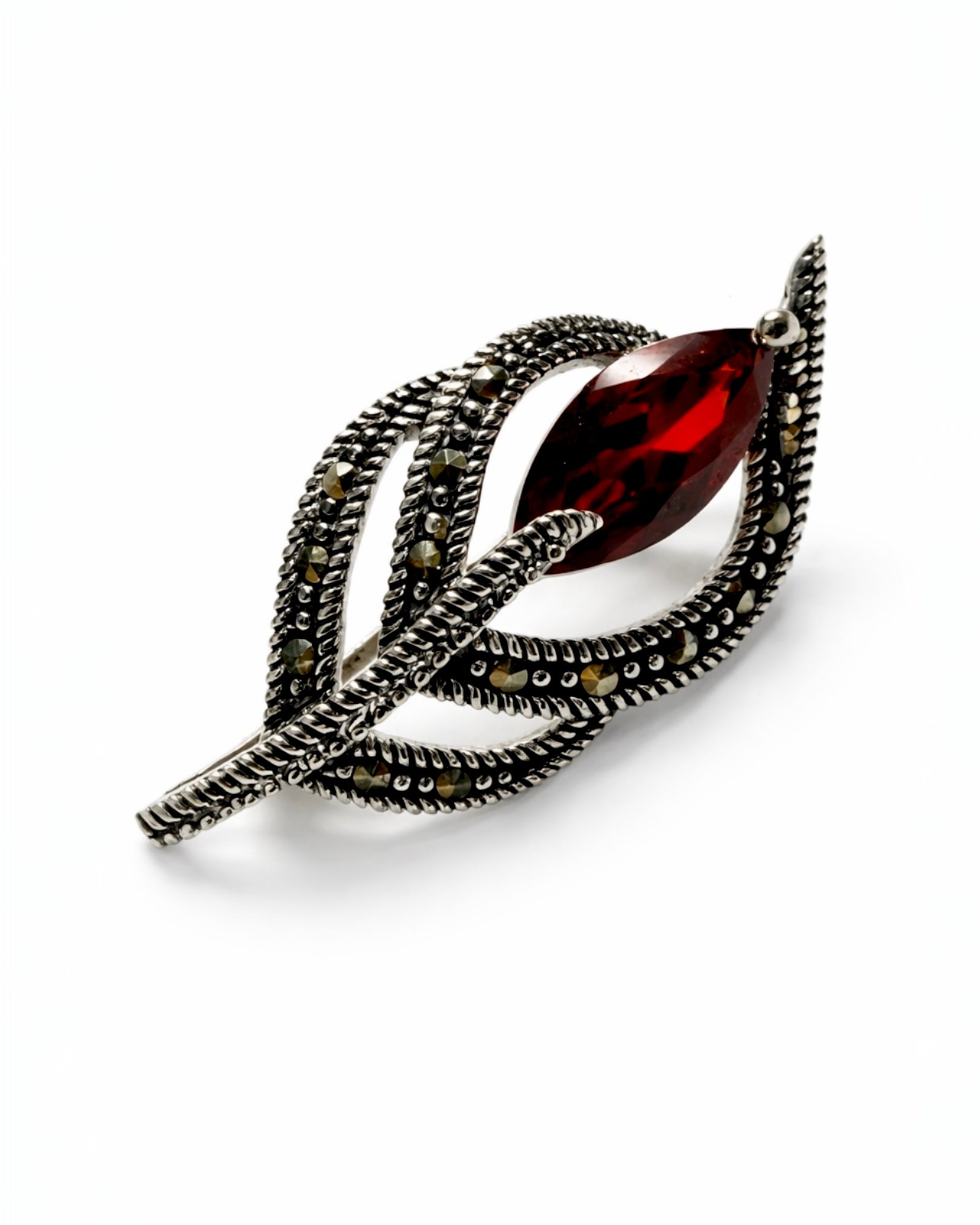 Silver-tone bow pin with marcasite and purple stone.